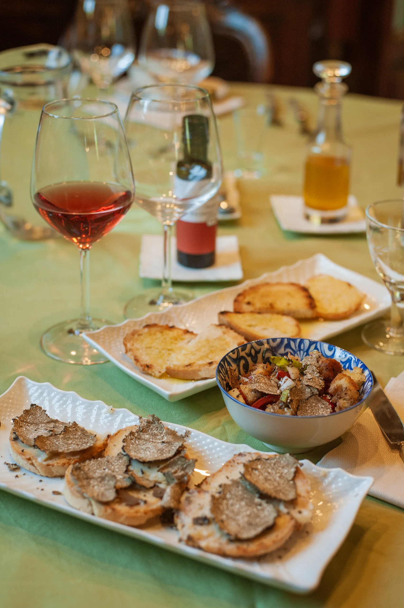 Truffle bruschetta and wine served at the villa table